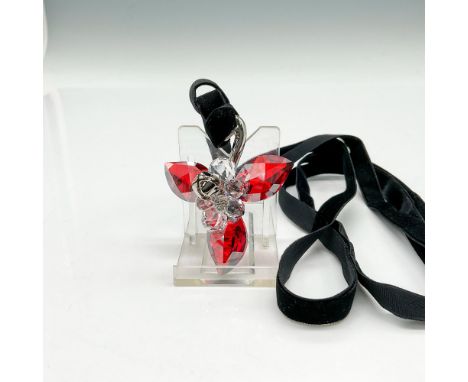 Part of the Merry Christmas collection. Designed with siam colored crystal leaves, clear crystal berries and bell mounted on 