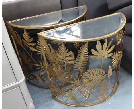 DEMI LUNE CONSOLE TABLES, a pair, gilt metal framed, each with a bevelled glass top and leaf decoration, 86cm W x 77cm H x 35