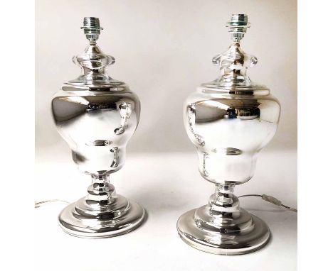 LAMPS, a pair, silvered glass of urn form, with shades, 54cm H. (2)