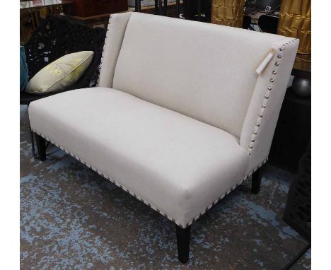 INDIA JANE SOFA, two seater, in beige fabric studded on square supports, 133cm L.