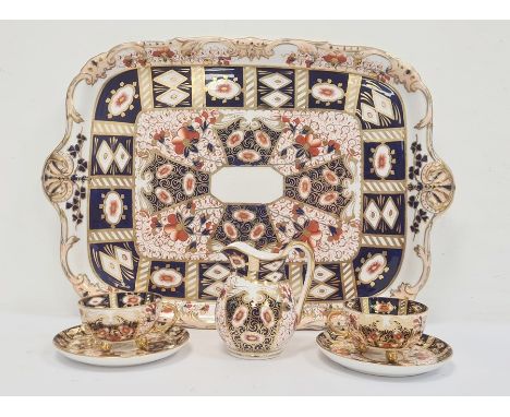 Pair of Davenport cups and saucers, matching milk jug and rectangular tray in the Imari paletteCondition ReportThe cups, sauc