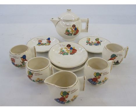 Child's part tea service comprising teapot, four cups and saucers and milk jug 'Dolly's Bedtime', 'Wendy Watering', 'Helping 