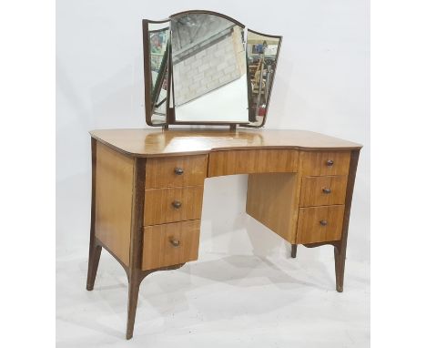 Heals of Tottenham Court Road, London dressing table with three-part mirror and shaped top, above seven assorted drawers, one