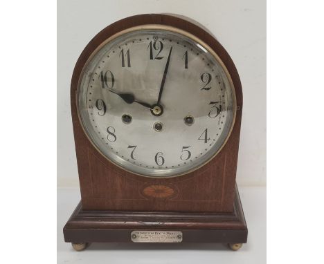 20th century mantel clock  by 'Junghans' in mahogany, the arched top body with Arabic numerals to the steel dial, with silver