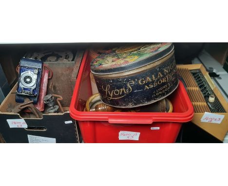 Bakelite Violetta vintage radio, brass model of a horse, assorted earthenware jars, two vintage tins, vintage flat irons, bel