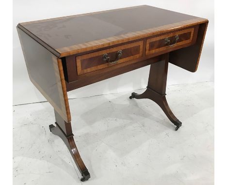 20th century mahogany and banded sofa table with end pedestal supports, cabriole legs, brass caps and castors 