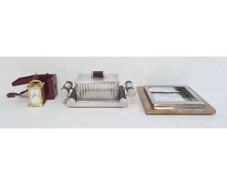 Chrome bakelite and pressed glass cigarette box of Art Deco design on mirrored two handled base, a brass squared dish and a L