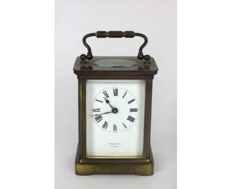 A small brass cased Carriage Clock, the white enamel dial with Roman numerals, and signed Rosenthal, Ottawa. (1)