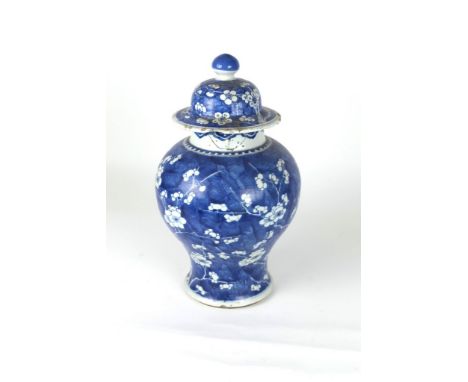 A late 18th Century Chinese blue and white Jar and Cover, of baluster form with domed cover and turned finial, 50cms (damaged