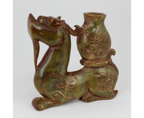 A 19th Century carved spinach jade 'Archaic', of  dragon with carved design, approx. 16cms x 16cms (6 1/2" x 6 1/2"). (1)