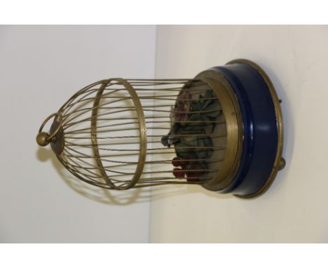 An attractive caged Bird Automaton, with pierced brass dome cage on shaped base, approx. 30cms (12") high. (1)