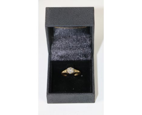 An attractive 18ct gold, 7 stone cluster Ring, with .28ct (tw), old style hand made. (1)