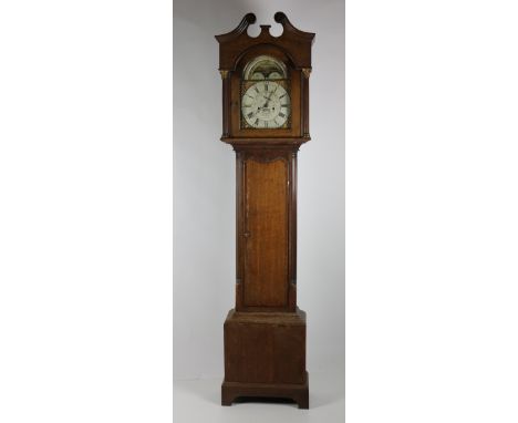 A late 18th Century / early 19th Century oak framed Grandfather Clock, the swan neck pediment over a marked dial with rotatin
