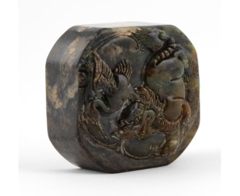 A Chinese hard stone Seal, the top carved with Fo lion and bird, 2" (5cms). (1)