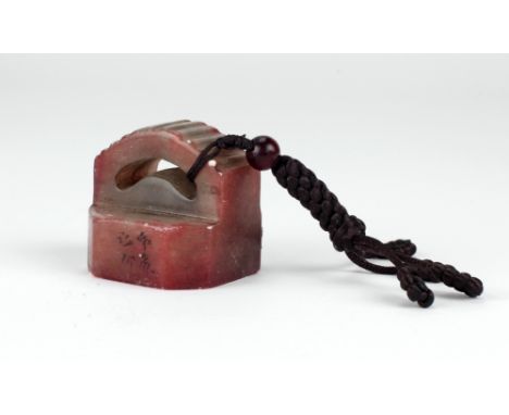 An octagonal shaped Chinese soapstone Seal, with arched and fluted top, 1 3/4" (4.5cms), signed. (1)
