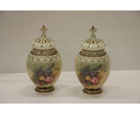 A very good pair of attractive bulbous shaped gilt highlighted and floral decorated Worcester Urns and Covers, with ornate pi