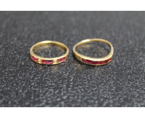 TWO 14K RUBY RINGS, one set with two diamonds - size L, the other on a twist band - size O, approx combined weight 2.9g