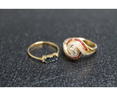 TWO 14K YELLOW METAL RINGS CONSISTING OF A RUBY AND DIAMOND 'SWIRL' PATTERN RING,  approx weight 4.9g, ring size M and a sapp