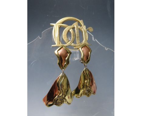 A VINTAGE PARFUMS CHRISTIAN DIOR GOLDTONE BROOCH, W 6.2 cm, together with a pair of hand crafted copper and goldtone clip on 
