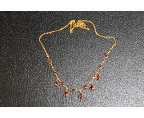 A YELLOW METAL RUBY AND DIAMOND NECKLACE, on a simple s shaped attachment, approx weight 8.4g, L 43 cm