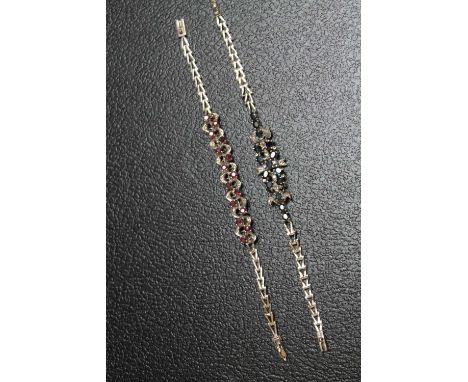 TWO GEM SET WHITE METAL BRACELETS, one set with ruby style stones, the other with sapphire style stones, approx combined weig