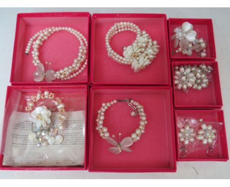 A COLLECTION OF FLORAL AND BUTTERFLY THEMED BUTLER AND WILSON JEWELLERY ITEMS, to include a fan shaped brooch and matching ba