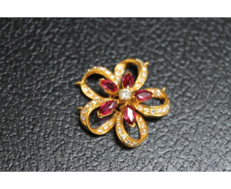 A RUBY AND DIAMOND PENDANT, set in unmarked yellow metal, approx weight 8.4g, Dia 3 cm