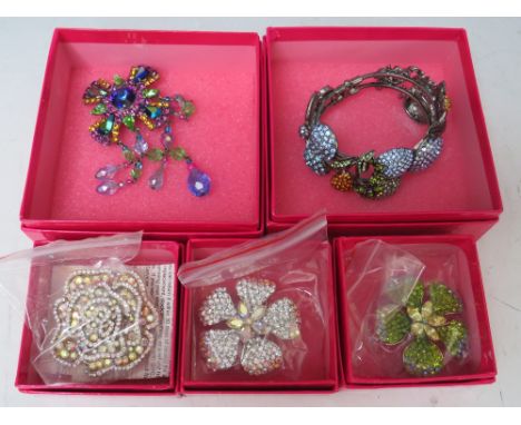 A BUTLER AND WILSON FRUIT THEMED CRYSTAL SET HINGED BANGLE, together with three smaller floral brooches - approx Dia. 5 cm pl
