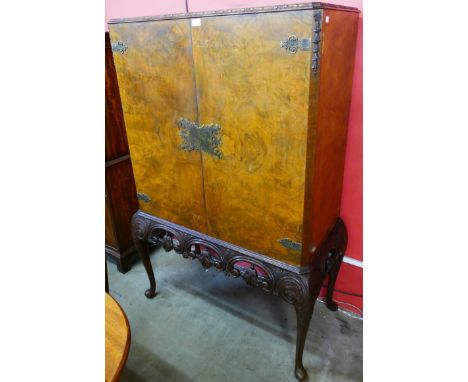 A Queen Anne style burr walnut cocktail cabinet 