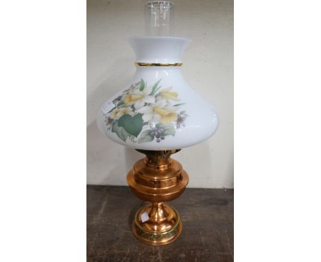 A copper and coloured glass oil lamp 