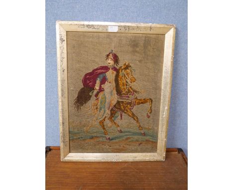 A Victorian woolwork tapestry depicting a Hussar with horse 