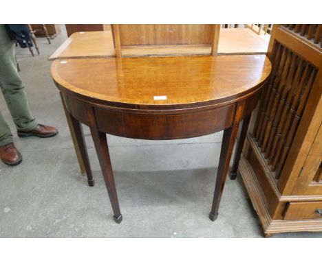 A George III inlaid mahogany demi lune card table 