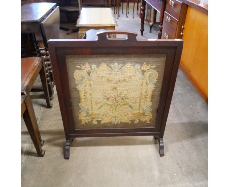 A firescreen with tapestry 