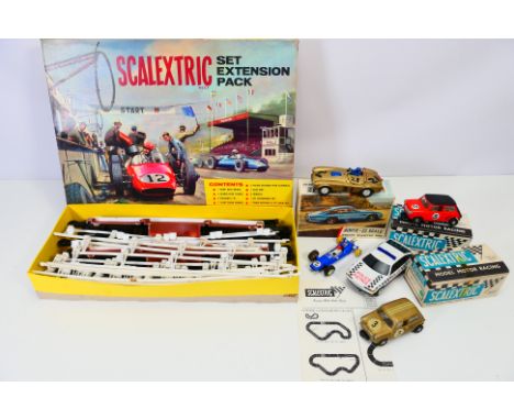 TRIANG - SCALEXTRIC - a boxed vintage Scalextric set extension pack HP/1 containing track, barriers, 4 cars and some paperwor