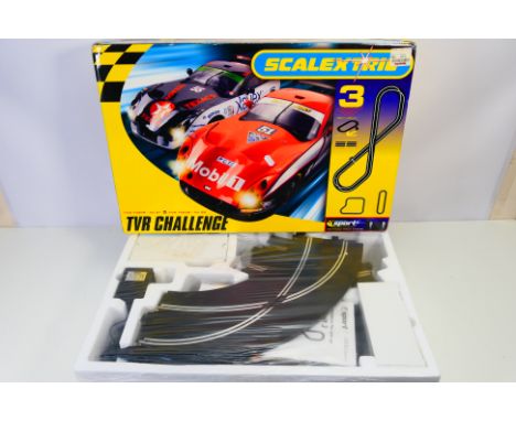 Scalextric - A boxed Scalextric C1121 1:32 "TVR Challenge " slot car set. The set appears to be in Mint condition with the co