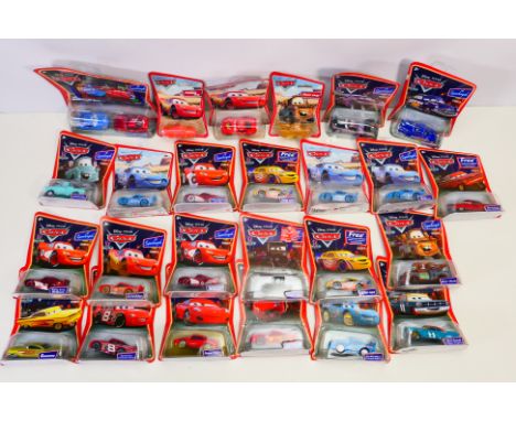 Disney - Pixar -  Cars - A collection of carded Cars models including Mater, Ramone, Lizzie, Boost, Fabulous Hudson Hornet an