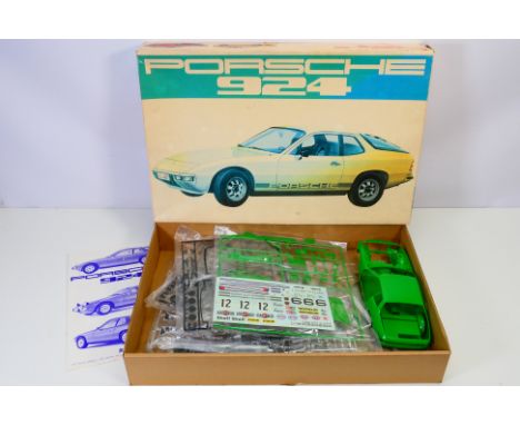 Bandai - A boxed 1970's Bandai #8044 1:16 scale Porsche 924 plastic model kit. The vintage kit appears to be in Mint conditio