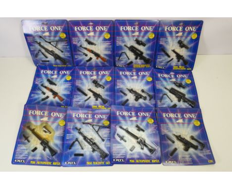 Ertl - 12 carded Ertl "Force One" diecast model guns. The lot includes #4971 M60 Machine Gun; #4973 AK-47; #4976 Famas Assaul