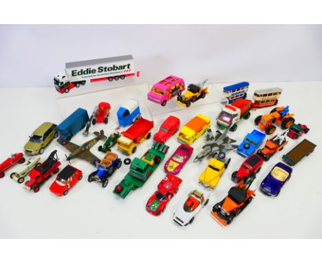 Diecast - A mixed lot of loose diecast vehicles to include: Corgi "Charlie's Angels", Oxford "Eddie Stobart", a white metal k