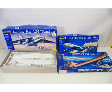 Revell - Three boxed Revell 1:144 scale commercial aircraft plastic model kits. Lot consists of Revell #0413 Illushin IL-86 -