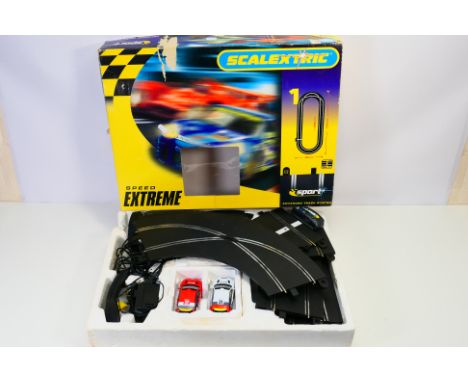 Scalextric - A boxed Scalextric C10902NA 1:32 "Speed Extreme" slot car set. The set comes with two Ford Focus rally cars, con