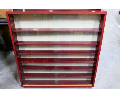 Wayfair - A professionally made tempered glass sliding door cabinet with wooden shelving. The cabinet measures approximately 