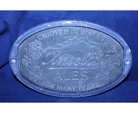 A vintage wall hanging plaque for Ansells Ales 