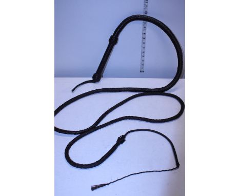 A long vintage leather bullwhip 
