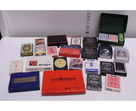 A job lot of assorted vintage playing cards etc. 