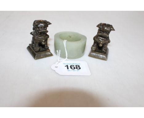 Jade Archers ring and two small bronze dog weights (3).