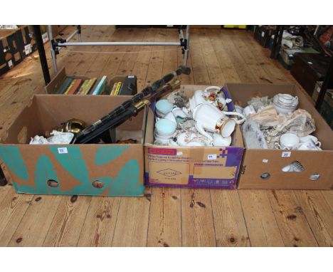 Four boxes of teaware including Royal Albert, children's annuals, bisque plaque, oil lamp, etc.