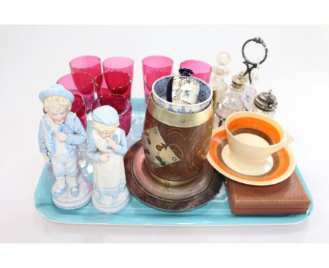 Nine Cranberry glasses, four bottle cruet, pair Continental figures, Clarice Cliff cup and saucer, etc.