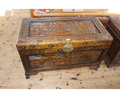 Oriental carved trunk, 62cm by 101cm by 52cm.