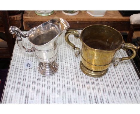 19th Century silver plated helmet jug, 20cm, together with antique two handled brass cup (2).